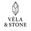 Logo of Véla & Stone with a geometric design on a white background